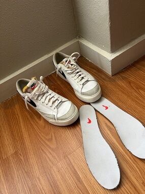 Nike White Low-Top Sneakers with Black Swoosh